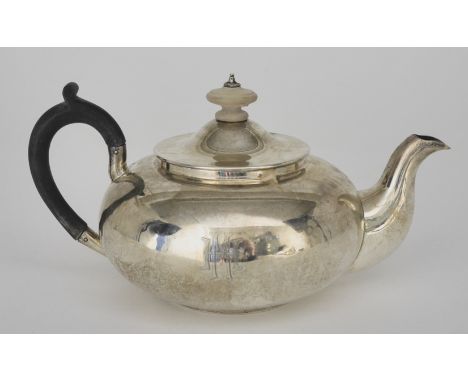 A Mid 19th Century Russian Plain Silver Teapot, by Andrei Kovalsky, Moscow 1855, with squat circular body with ebonised handl