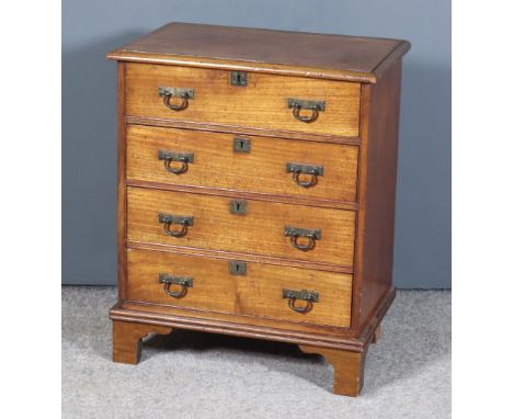 A Late Victorian Mahogany Chest of Small Proportions, fitted four long drawers with brass folding handles with rectangular ba