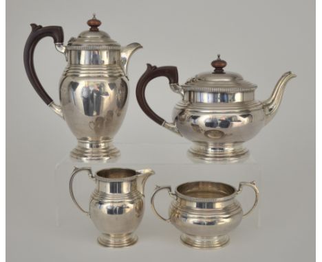 An Elizabeth II Harlequin Silver Four Piece Tea Service, by Barker Bros Silver Ltd, Birmingham 1949 and 1958, with reeded mou
