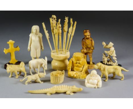 A Japanese Carved Ivory Netsuke, Meiji Period, carved in the form of a seated figure of a bearded sage, 1.75ins high (4.5cm),