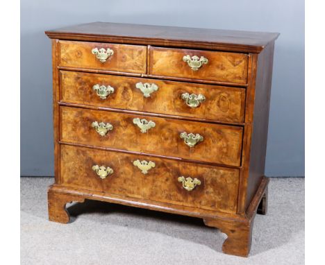 An 18th Century Walnut and Oak Sided Chest, with cross banded top and moulded edge, fitted two short and three long drawers w