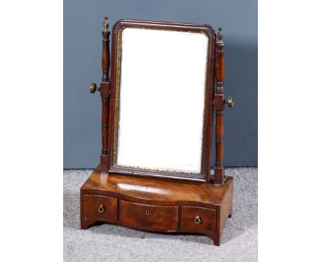 A George III Framed Rectangular Toilet Mirror, with moulded frieze on slender turned uprights, serpentine fronted base inlaid