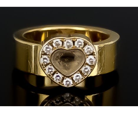 A "Happy Diamonds" Diamond Ring, Modern, by Chopard, in 18ct gold mount, Serial No. 2770480, set with twelve small diamonds i