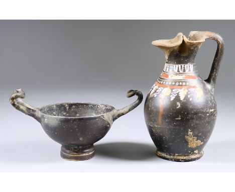 A Gnathian Ware Black Glazed Olpe, 4th Century BC, typically painted in a limited palette with a pattern of grapes, leaves an