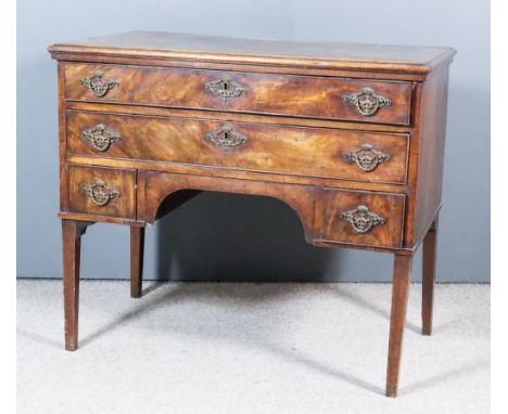 An 18th Century Continental Figured Mahogany Secretaire Commode, the top inlaid with bandings and with moulded edge, with fal