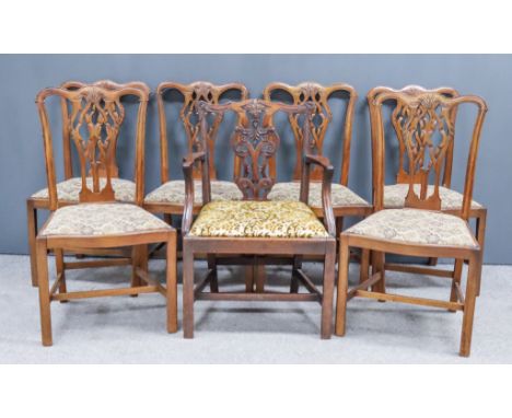 A George III Mahogany Armchair and a Set of Six Similar Mahogany Dining Chairs of "George III" Design, the armchair with shap