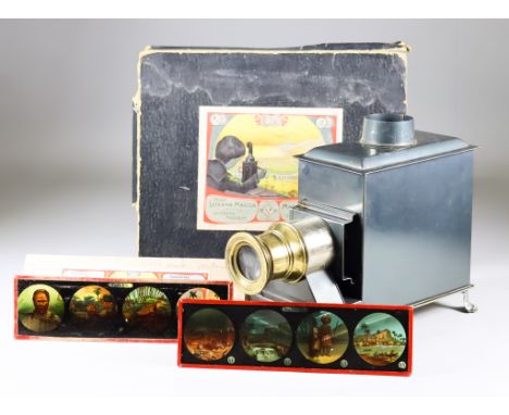 A Gebrüder Bing German GBN Toy Tin-Plate Magic Lantern, Circa 1905, with chimney, burner and single objective lens, contained