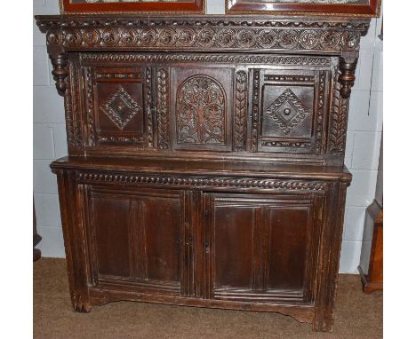 An early 18th century and later carved court cupboard, 149cm by 142cm by 60cmCondition report: Top boards later hinged, to re