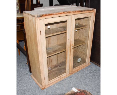 A three panelled oak headboard, together with a Victorian pine two door glazed cupboard (2)Condition report: Headboard - 140c