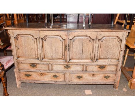 A George III light oak mule chest (the top section converted to a cupboard and raised over five drawers), 170cm by 55cm by 97