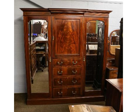 A good quality Edwardian satinwood inlaid mahogany triple wardrobe with ebonised stringing, with a moulded breakfront cornice