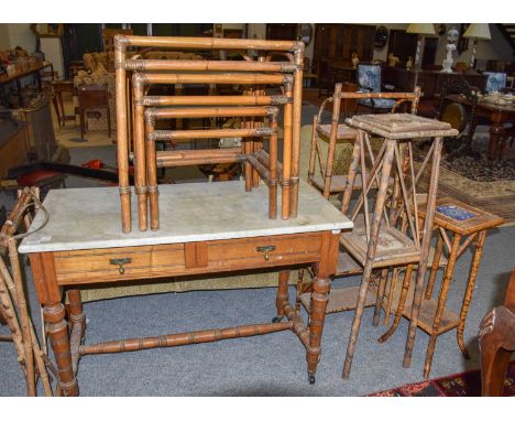 ~ A Victorian marble-topped oak washstand (a.f.), 108cm by 52cm by 77cm, together with a nest of three bamboo tables with gla