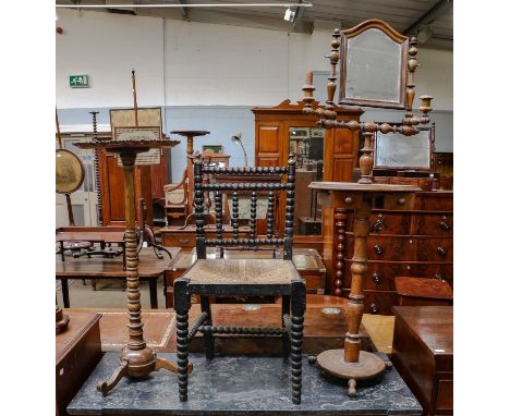 ~ A 19th century provincial oak turned shaving stand fitted with two adjustable candle sconces, 130cm high, together with a t