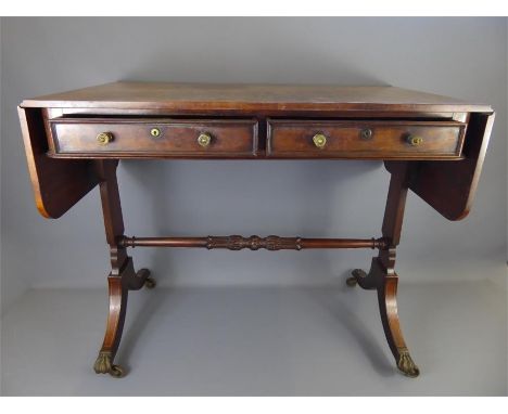 A Victorian Mahogany Drop-leaf Sofa Table, two drawers, approx 144 cms extended x 51 x 75 cms high, twin splayed supports wit