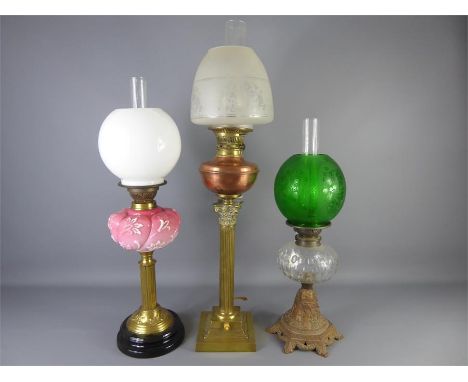 A Brass Late Victorian Cut-glass Oil Lamp, the first having a brass base with cut-glass font and an emerald green shade, appr