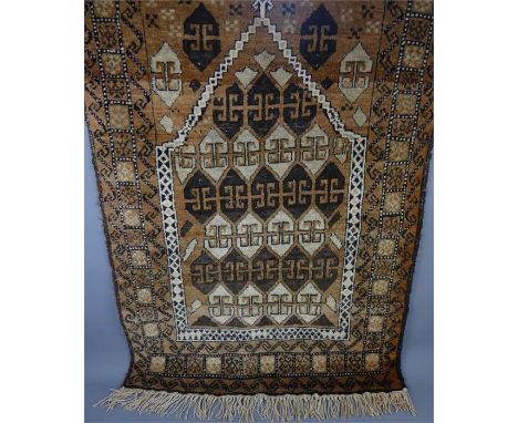 An Antique Oriental Carpet, russet and cream with Mosque motif pattern, approx 140 x 78 cms.