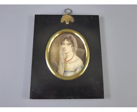 A 19th Century Portrait Miniature, of a veiled young woman, approx 6 x 7.5 cms, presented in an ebonized frame.&nbsp;