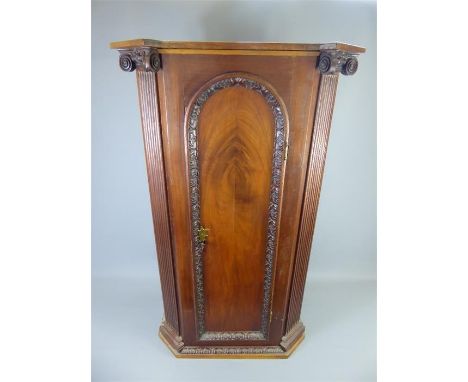 An Antique Mahogany and Oak Cupboard, with carving to front door and base, Corinthian style carved pillars to either side of 