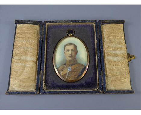 A Fine 19th Century Portrait Miniature, depicting a young officer in dress uniform, presented in an oval frame and blue leath