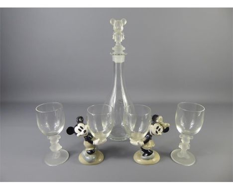 A Mickey Mouse 'Disneyland Paris' Wine Decanter with frosted glass stopper, together with six wine glasses, two with frosted 