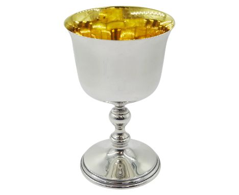 Modern Irish silver goblet, the plain circular bowl with slightly flared rim and gilt interior, upon a baluster knopped stem 