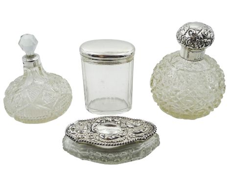 Two clear cut glass dressing table bottles, the first Victorian example of spherical form with octagonal and hobnail cut deco