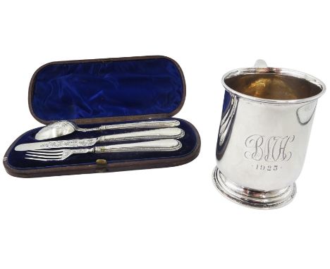 1920's silver christening mug, of plain form with engraved monogram and date to body and scroll handle, upon a circular stepp
