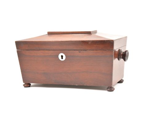Victorian rosewood tea caddy, sarcophagus form with turned handles, bun feet, the interior with two caddies, 39cm.