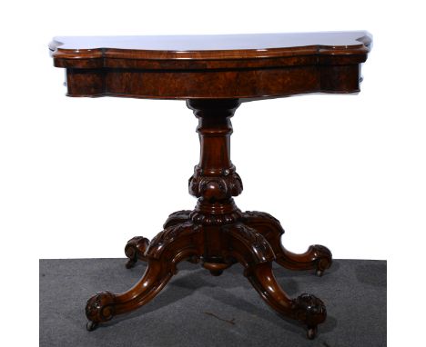 Victorian burr walnut card table, serpentine foldover top enclosing a baize lined interior, plan frieze, carved turned column