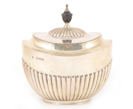 A Victorian silver tea caddy, William Hutton &amp; Sons, London 1891, oval semi-fluted form, hinged lid with ebony urn finial