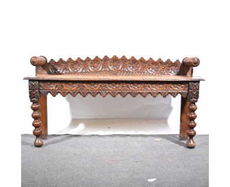 Victorian oak hall bench, carved back with floral roundels, matching frieze, bobbin turned arms and legs, length 120cm, depth