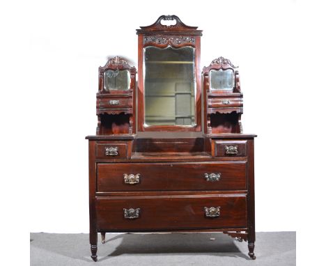 Victorian mahogany dressing table, triple mirror with carved pediments above trinket drawers, four further drawers under, tur