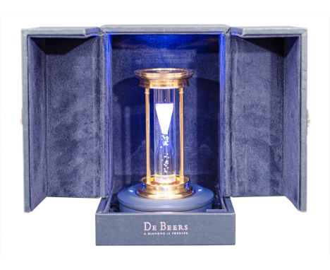De Beers - A Diamond Hourglass containing a cascade of over 2000 natural rough diamonds, weighing approximately 36 carats in 