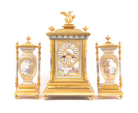 A Napoleon III gilt and silvered metal three-piece mantel garniture, with painted porcelain panels, the dial centred by a lan