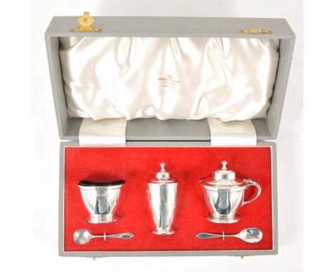 A five-piece silver condiment set, George Tarratt Limited, Sheffield 1961, comprising a mustard pot, cast finial, tapering fo