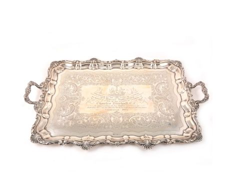 A large silver presentation tray, Joseph Rodgers &amp; Sons, Sheffield 1901, with shell-moulded outlines, the field chased an