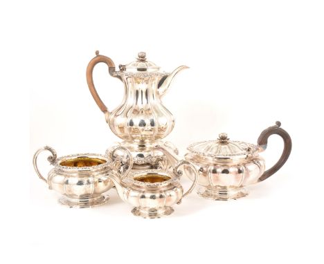 A George IV silver four-piece teaset, Benjamin Smith, London 1823, each piece of squat lobed and ribbed circular form with ca