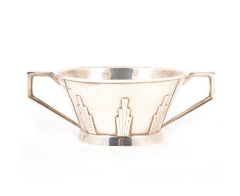 An Art Deco silver basin, Barker Brothers Silver Ltd, Birmingham 1931, flared circular form with twin handles and vertical mo