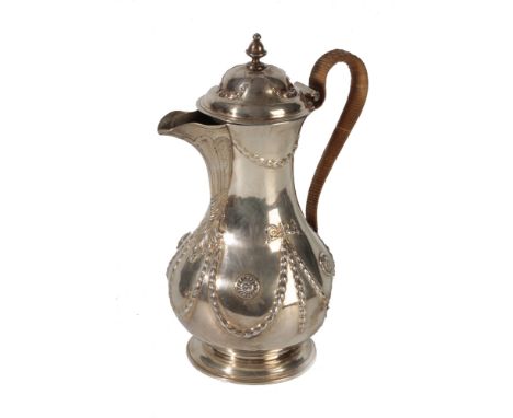 GEORGE III IRISH SILVER COFFEE POT, by Richard Williams, Dublin, 1785, baluster form, the hinged domed cover with knop finial