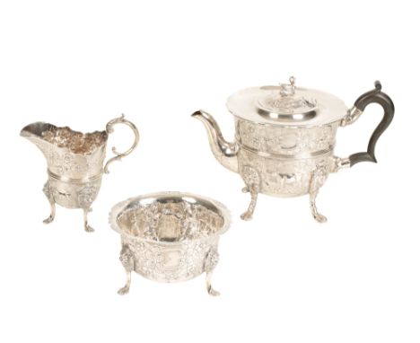 EDWARDIAN IRISH SILVER THREE-PIECE TEA SET, by John Smith, Dublin, 1908, circular form, wooden scroll handle, the hinged top 