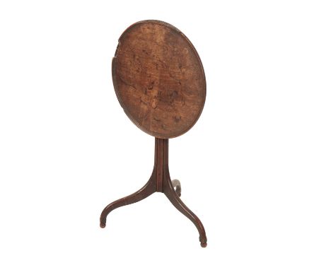 GEORGE II OAK TILT-TOP OCCASIONAL TABLE, the circular top above a fluted stem, on three cabriole Chippendale style legs, term