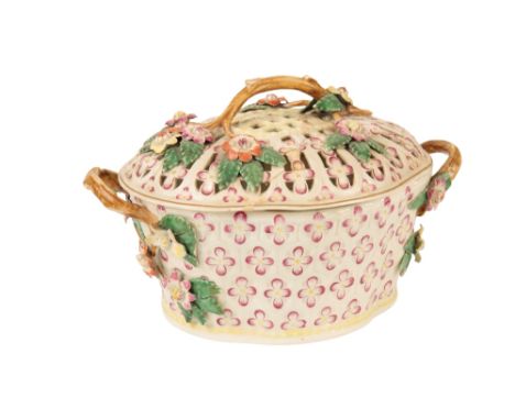 WORCESTER OVAL CHESTNUT BASKET AND COVER moulded with panels of formal florets, picked out in puce, the pierced cover applied