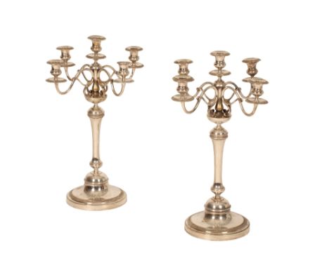 CHRISTOFLE: A PAIR OF FRENCH SILVER PLATED FIVE-LIGHT CANDELABRA, circular form, fluted knopped stems, with four leaf-capped 