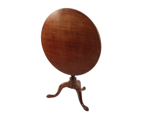 GEORGE III MAHOGANY TILT-TOP TRIPOD OCCASIONAL TABLE, the circular top, raised on a baluster stem, terminating on three cabri