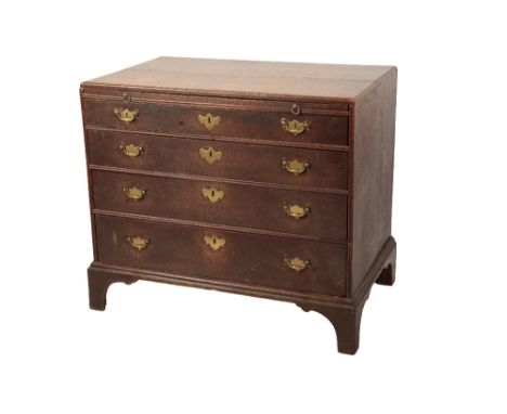 GEORGE III OAK CHEST OF DRAWERS circa 1760, the caddy moulded top above a brushing slide above four long graduated doors on s