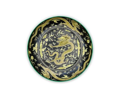 A Chinese black ground 'five dragons' plateRepublic periodRaised on short tapered foot rising to shallow sides to a mouth rim