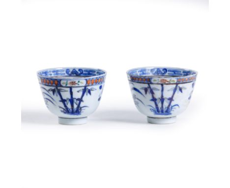 Two Chinese wucai gilt 'four gentlemen flowers' cupsQing dynasty, 19th century, apocryphal Kangxi six-character markPainted t