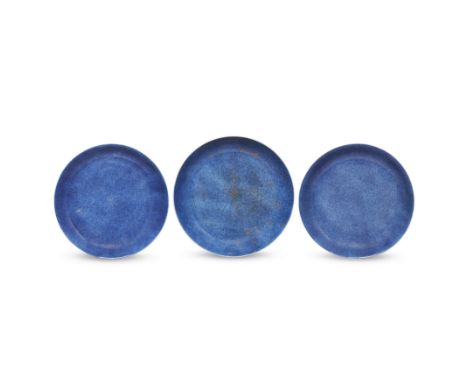 Three Chinese powder blue glazed dishesQing dynasty, Kangxi periodComprising a gilt decorated dish painted to the centre with