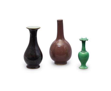 Three small Chinese monochrome vasesQing dynasty, 19th centuryComprising a black-glazed vase with splayed foot and flared rim