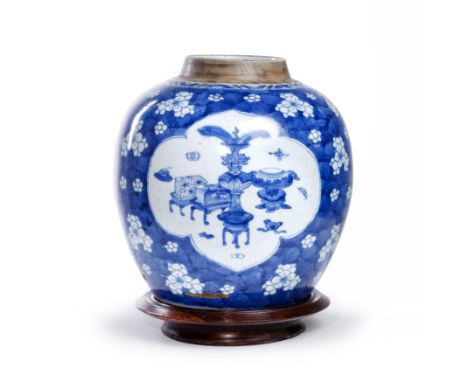A Chinese blue and white 'hundred antiques' jarQing dynasty, Kangxi periodDecorated with three quatrilobe panels of 'precious